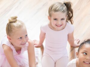 Young dancers smile during a break